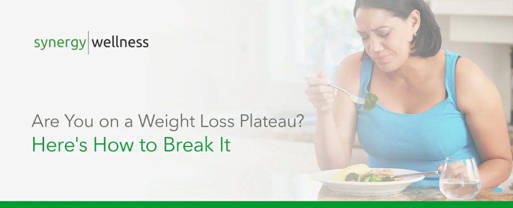 Woman Eating Salad - How to Break a Weight Loss Plateau | Weight Loss Center - Bakersfield CA